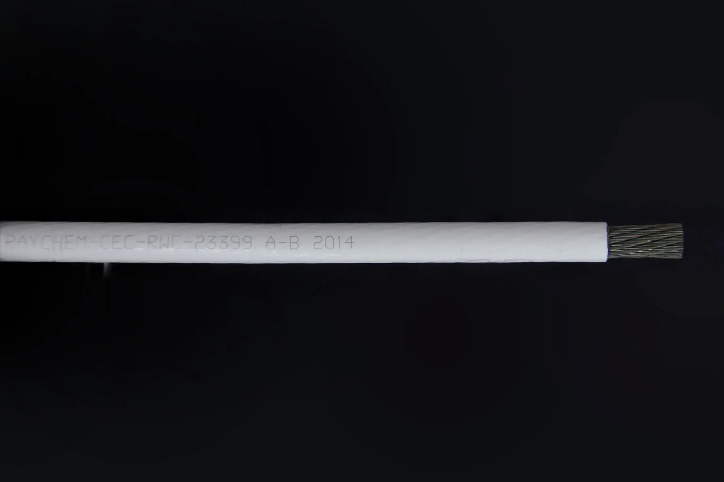 RAYCHEM-CEC-RWC-23399 A-B 2014 white colored wrapper for black wire.